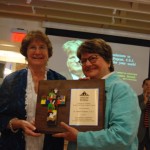 Loretta Holstein and Sr. Helen Prejean with the Robert M. Holstein Award plaque