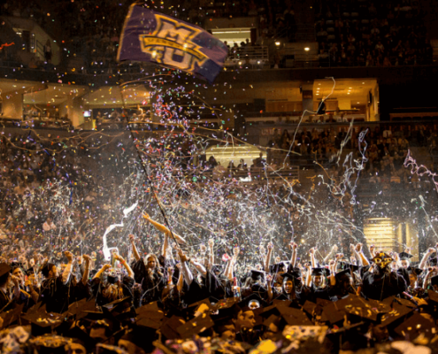 Marquette University graduates celebrate during the 2014 commencement ceremony [Marquette University]