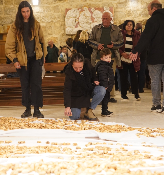 Mother and daughter place a olive wood heart in Bethlehem on Feast of the Holy Innocents to commemorate 8,000 children killed in Holy Land