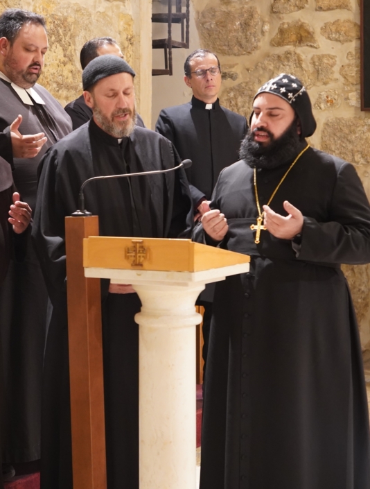 Syriac Catholic and Syriac Orthodox priest leading prayer at Church of the Nativity